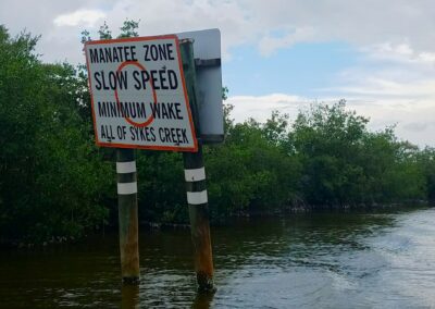 Slow speed sykes creek manatee sign